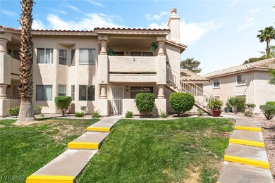 View of front facade with a balcony, a chimney, st