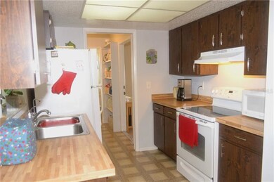 Galley kitchen with window to lanai