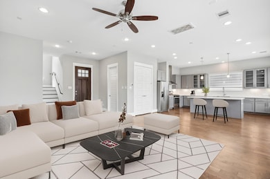 Living room is large and open with high ceilings a