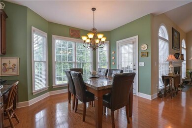 Large breakfast room with built-in desk measures 13 x 12