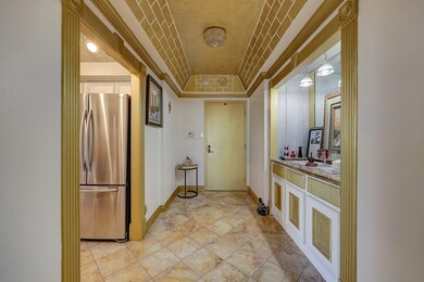 Alternate view of the formal entry showing kitchen to the left.