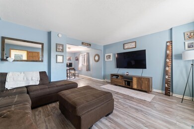 Living room featuring hardwood / wood-style floori