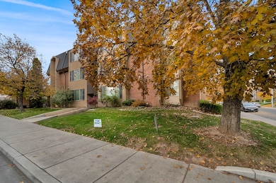 View of front facade featuring brick siding and a front lawn