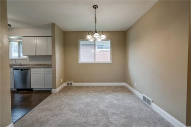 Nice sized dining room which leads into the kitche