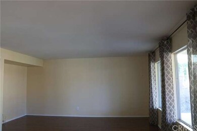 Extra-large family room with entertainment niche.