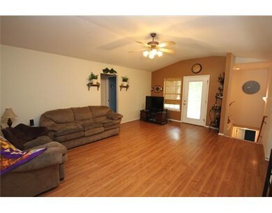 Living Room. New Carpet, wood laminate flooring in living room & dining room