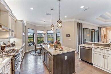 Gourmet kitchen with casual dining area, island.