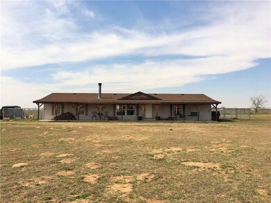 front of home, notice that sprawling front porch! 