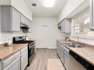 Kitchen featuring appliances with stainless steel
