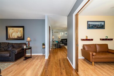 Enter living room to your left and Home office with pocket doors on your right.