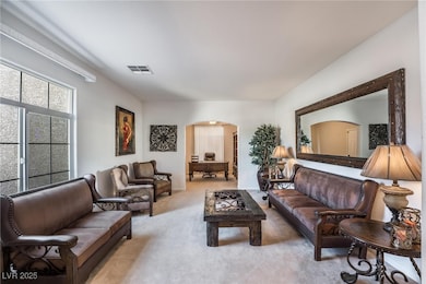 living area that leads into a custom office.