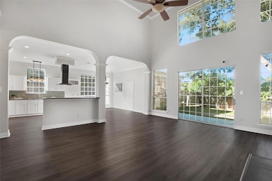 featuring a towering ceiling, decorative columns, 