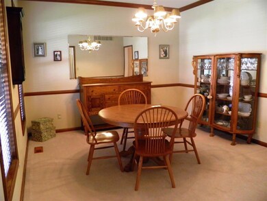 Pretty dining room with crown molding and chair ra