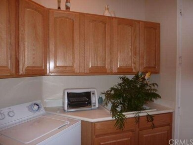 Laundry room with sink and extra cabinets