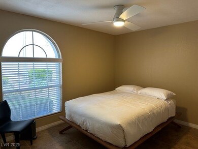 Master bedroom with gorgeous full length window