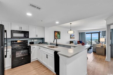 Kitchen with visible vents, a sink, black applianc
