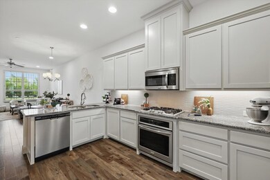 Kitchen with a sink, appliances with stainless ste