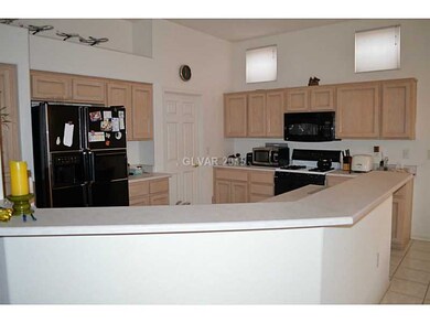 Property Photo. Kitchen with elevated counter