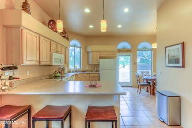 Breakfast Bar Seating Leading to Kitchen