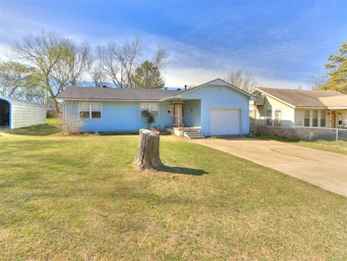 Ranch-style house with concrete driveway and a garage