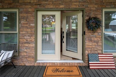 Doorway to property with a wooden deck
