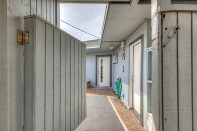 Entrance to private fenced courtyard