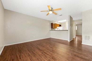 Unfurnished living room featuring ceiling fan, da