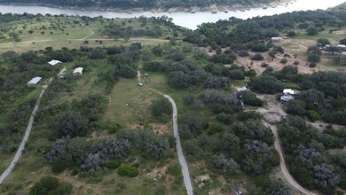 Aerial overview of property's location with a lar