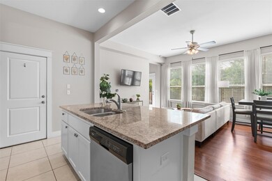 Kitchen with dishwasher, a sink, ceiling fan, ope