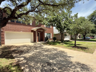 View of front of house with concrete driveway, a 