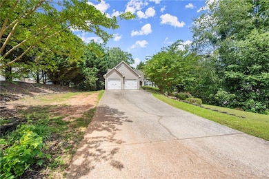 View of front of property with a front lawn and driveway