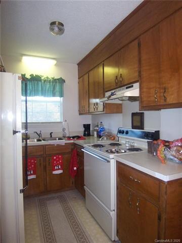 Kitchen has an electric range.