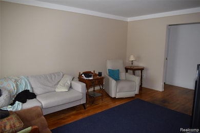 Living area featuring wood finished floors