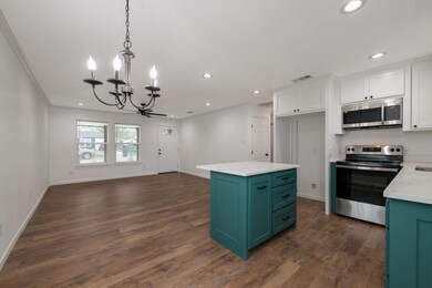 Kitchen featuring white cabinets, a notable chande