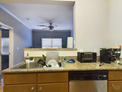 Kitchen with stainless steel dishwasher, a sink, 