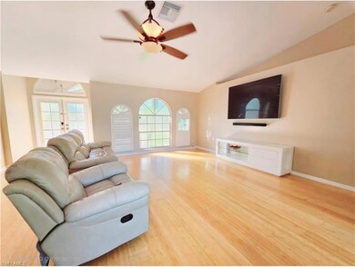 Living room featuring french doors, natural light,