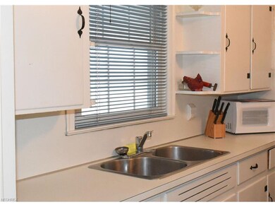 The neat, clean kitchen is well -appointed with an