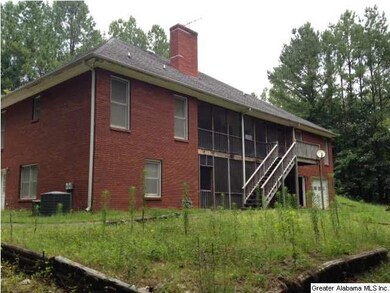 Rear of home showing Screened-in porches on both l