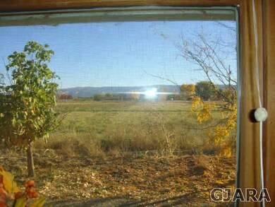 View of neighbors field from kitchen sink