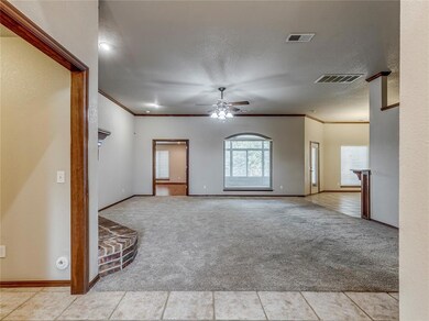 Empty room with light colored carpet, crown moldin