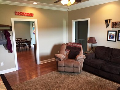 Large living room with trey ceiling 