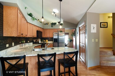 Kitchen features solid wood cabinetry, newer appli