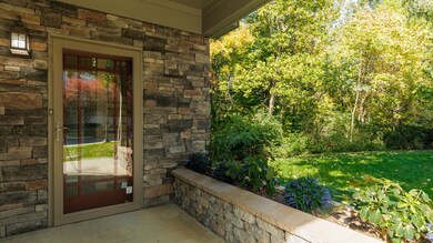 Welcome, covered front porch and flower beds
