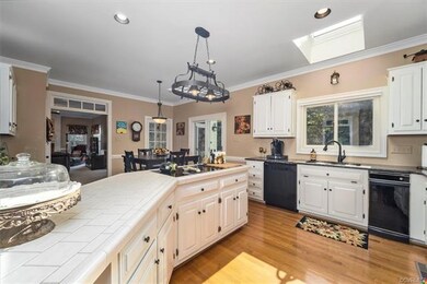 Kitchen with Large Island, Jenn-Air Stove Top and 