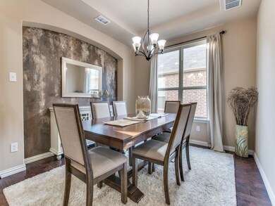spacious dining area features custom painted wall