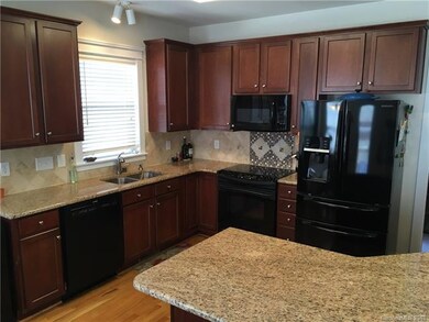 Updated kitchen with 42 inch cherry cabinets, gran