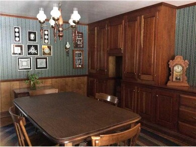 Dining Room. Custom cherry cabinetry provides stor