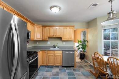 Updated eat-in kitchen with newer stainless steel appliances
