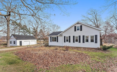 The two car detached garage is located right across the driveway from the house.