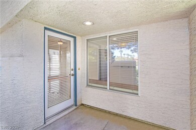 Private entry with enclosed, gated patio. This pic
